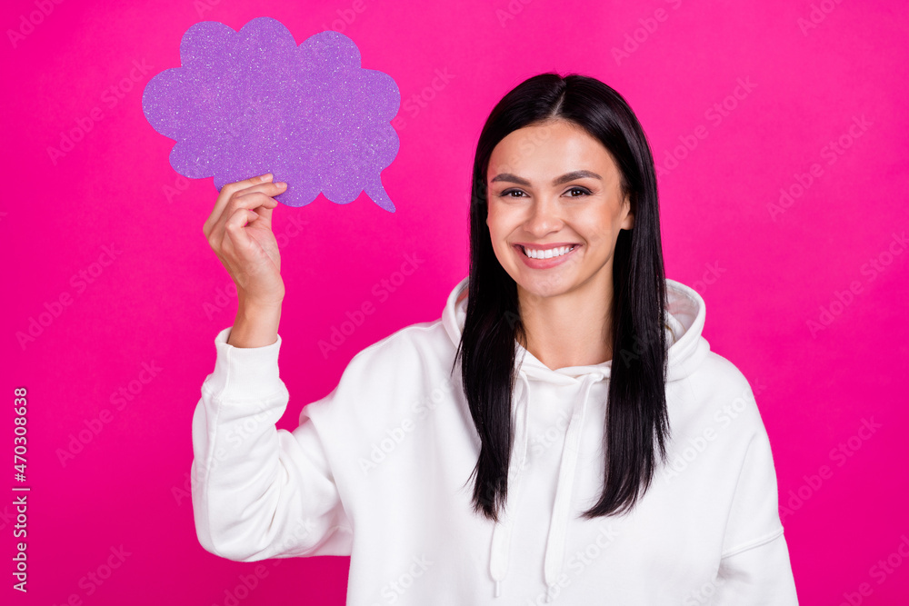 Photo of smart cheerful clever lady hold speech bubble wear white hoodie isolated pink color background Photo of smart cheerful clever lady hold speech bubble wear white hoodie isolated pink color background