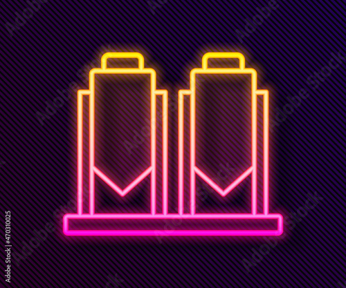 Glowing neon line Traditional brewing vessels in brewery icon isolated on black background. Beer brewing process. Distillery plant, brewery. Vector