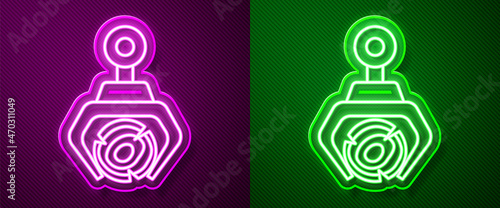 Glowing neon line Grapple crane grabbed a log icon isolated on purple and green background. Forest industry. Industrial crane for lumber trunk wood production. Vector