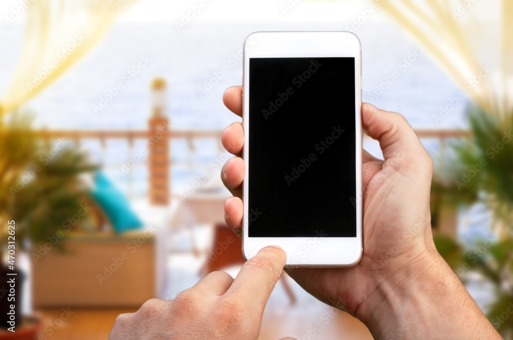 Hand hold a smartphone with a blank screen Hand hold a smartphone with a blank screen