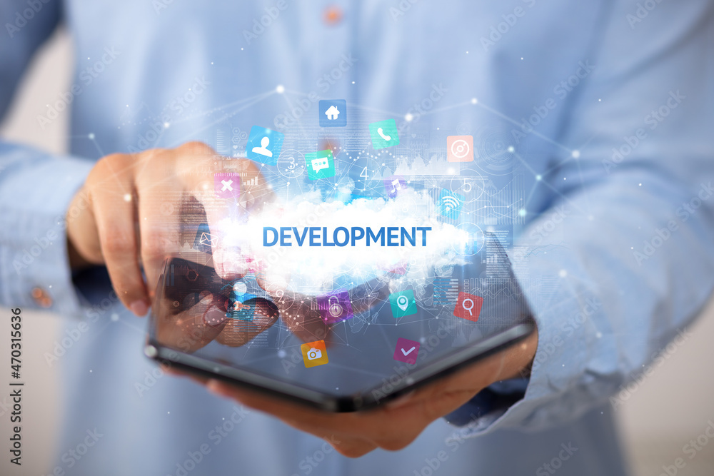 Businessman holding a foldable smartphone, technology concept
