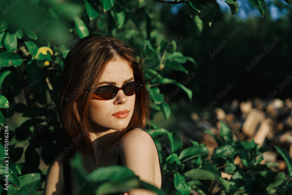 pretty woman wearing sunglasses green leaves posing summer pretty woman wearing sunglasses green leaves posing summer