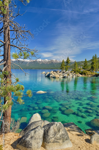 The beautiful clear waters and granite boulders of Lake Tahoe on the Nevada and California border