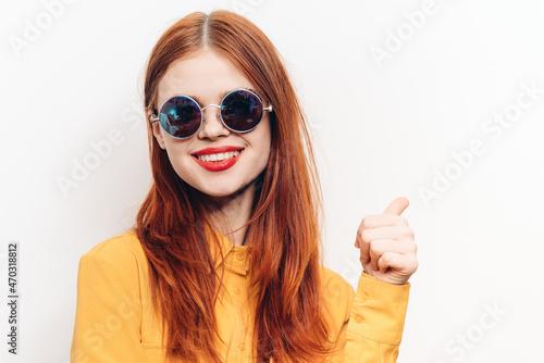 cheerful attractive woman in yellow shirt fashionable clothes sunglasses