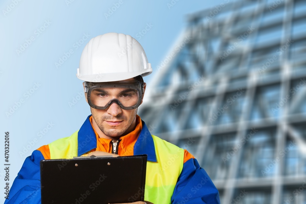 Fototapeta premium building contractor man Check and write down the details of the construction.