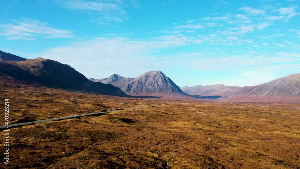 DRONE: Scottish mountain on a bright day driving forward in the Scottish highlands DRONE: Scottish mountain on a bright day driving forward in the Scottish highlands