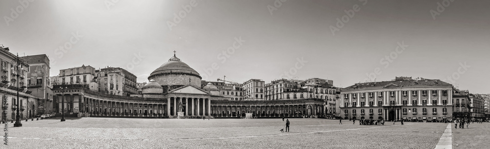 Naples, Italy. April 4, 2013. Retro-style panoramic view of Piazza Plebiscito with a few people walking around.