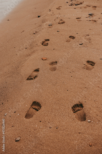Human footprints in the sand. Yellow sand .Summer holidays. Orange sand. Yellow sand