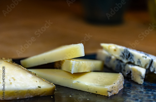 Variety of cheese cut into slices
