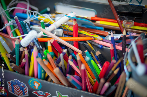pencils, colored pencils, creative clutter on the table, drawing tools, children's creativity