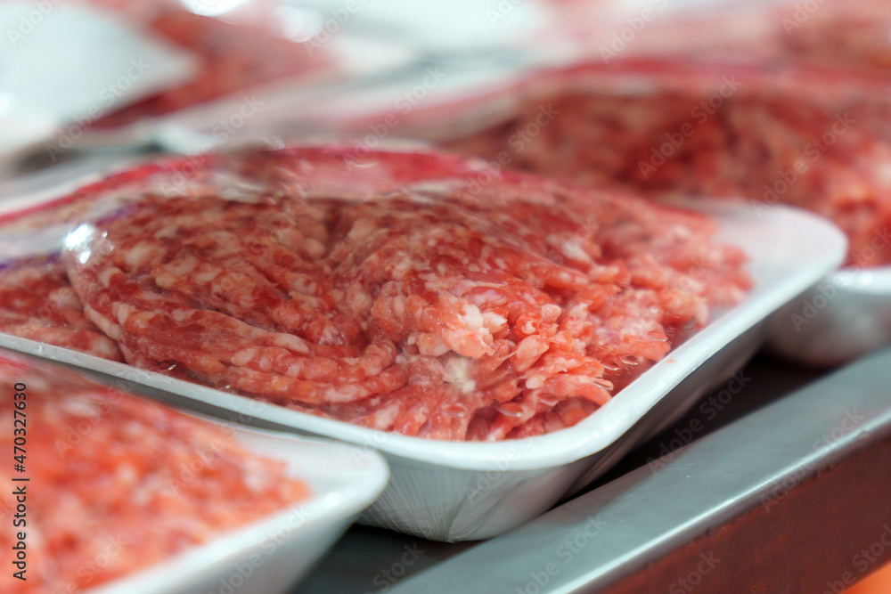 Raw fresh beef meat on the shelves of a hypermarket. Buying raw meat Raw fresh beef meat on the shelves of a hypermarket. Buying raw meat