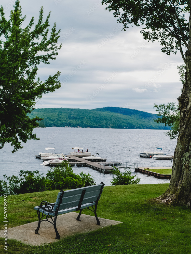 Fototapeta premium bench by the adirondack mountain lake