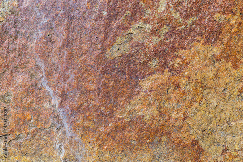 Granite stone texture. Cracked granite rock surface. Natural stone backdrop. Close-up
