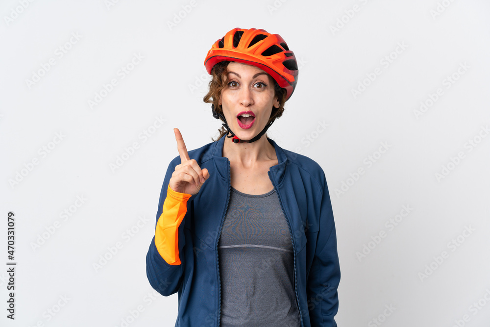 Young cyclist woman isolated on white background intending to realizes the solution while lifting a finger up Young cyclist woman isolated on white background intending to realizes the solution while lifting a finger up