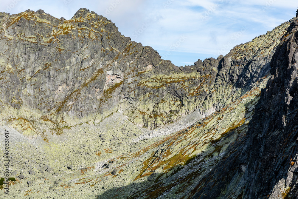 High Tatras. A view of the vertical wall with climbing routes marked out.