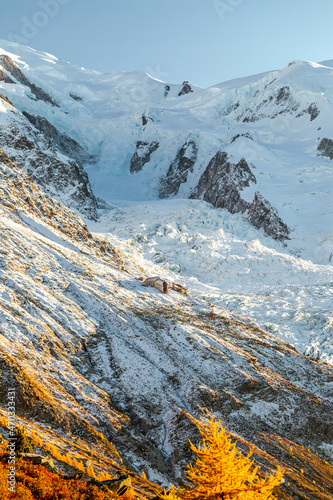 Sunset light scattered on ice glacier. Shot taken during hiking through point-to-point trail located near Chamonix-Mont-Blanc. Mer de Glace via Grand Balcon Nord.