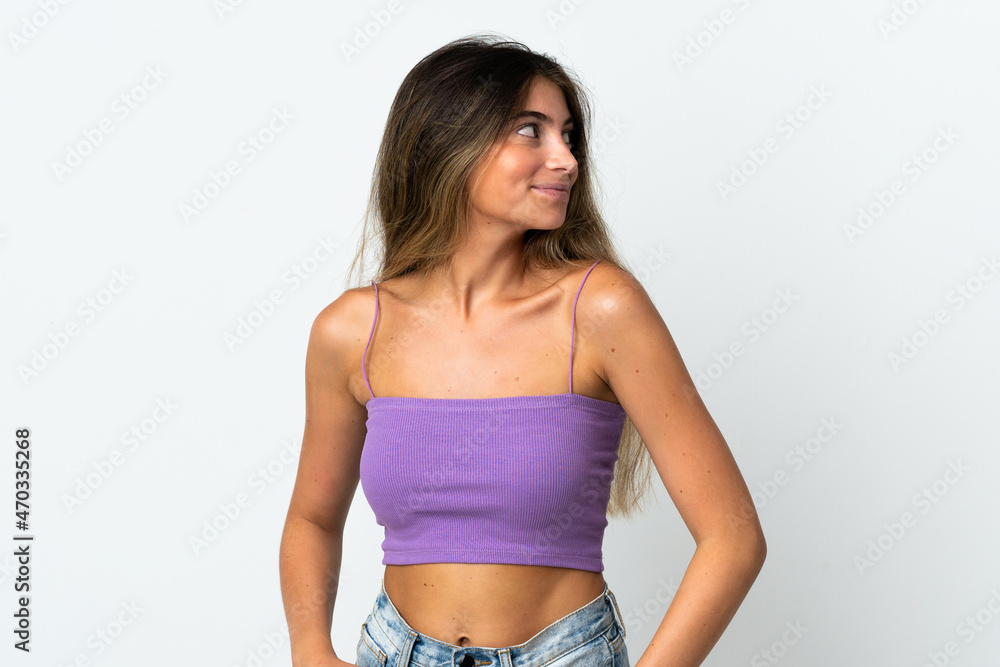 Fototapeta premium Young caucasian woman isolated on white background looking to the side