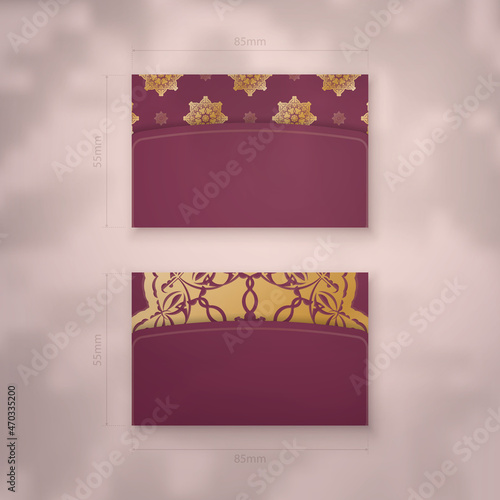 Presentable burgundy business card with vintage gold pattern for your business.