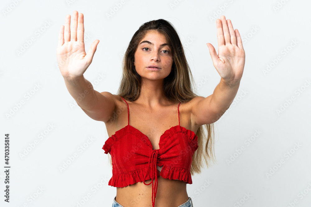 Young caucasian woman isolated on white background making stop gesture and disappointed Young caucasian woman isolated on white background making stop gesture and disappointed