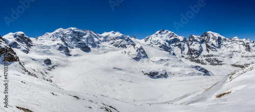 Panorama of Swiss Alp mountains ridge of Diavolezza with sumit group: d’Arlas, Cambrena, Palue, Bellavista, Bernian, Rosseg, Provat, Morteratsch in Canton Grisons, Switzerland photo