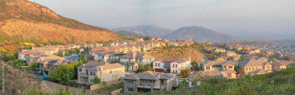Rows of suburban houses along the curved road at Double Peak Park, San Marcos, California