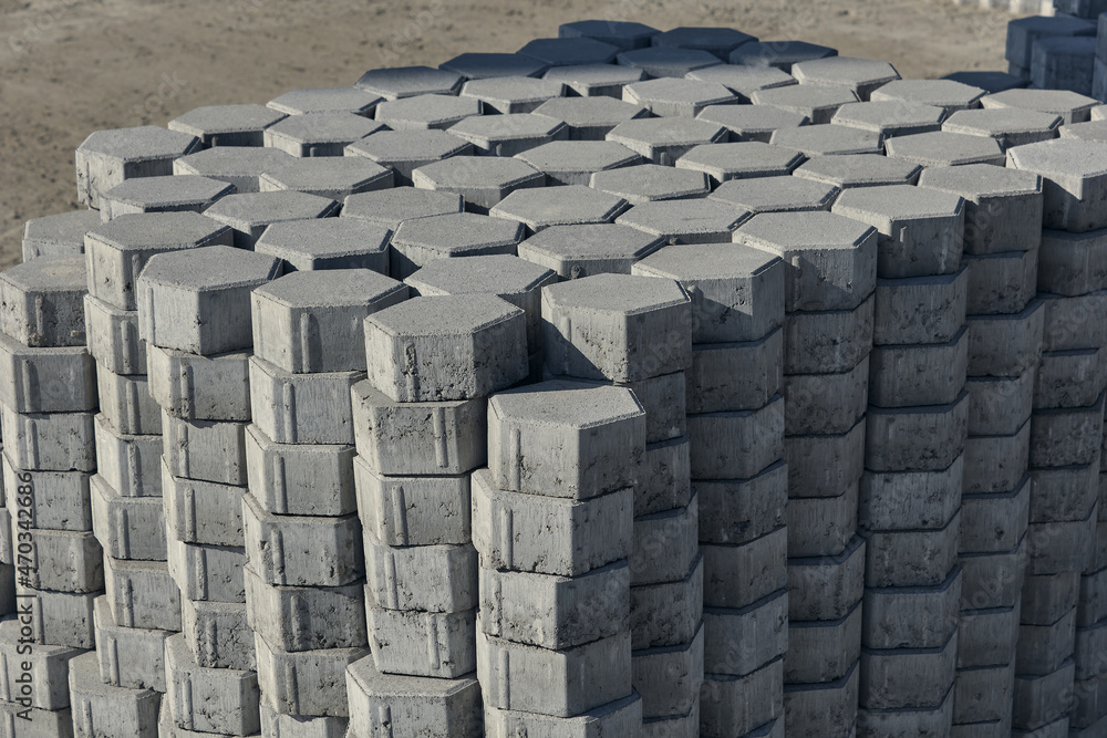 Obraz premium Gray pavement bricks for pavement road. Stack paving stones stacked in stacks. 