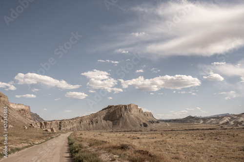 Dirt Road Heads Toward Ridge Rising From Desert Floor