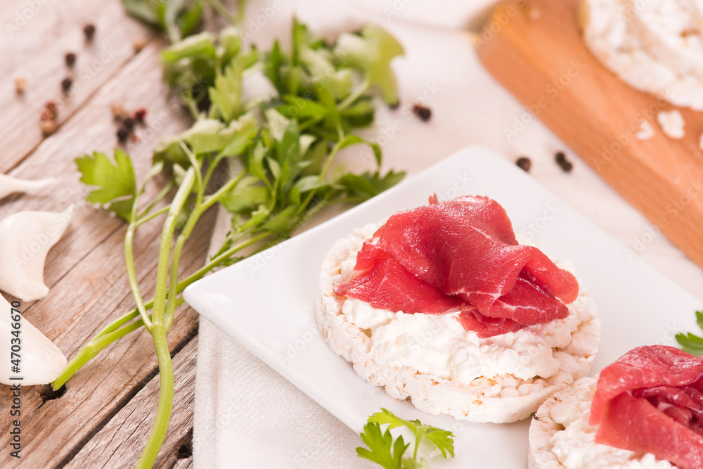 Rice cakes with milk flakes and cold beef. Rice cakes with milk flakes and cold beef.