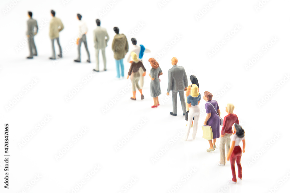 miniature people. different people stand in line one after another on a white background. communication of society of different generations miniature people. different people stand in line one after another on a white background. communication of society of different generations