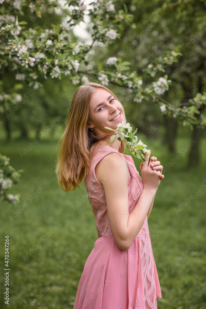 beautiful caucasian girl in blooming gardens beautiful caucasian girl in blooming gardens