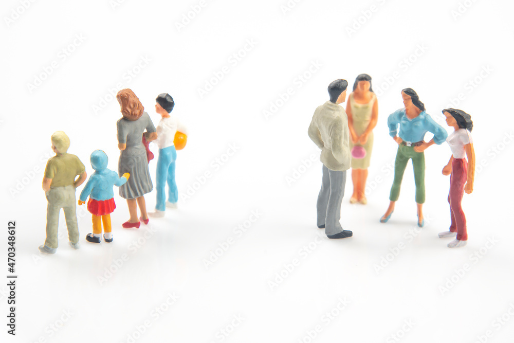 miniature people. concept of family people in relationships on a white background. the problem of fidelity in marriage. raising children in problematic relationships in the family.