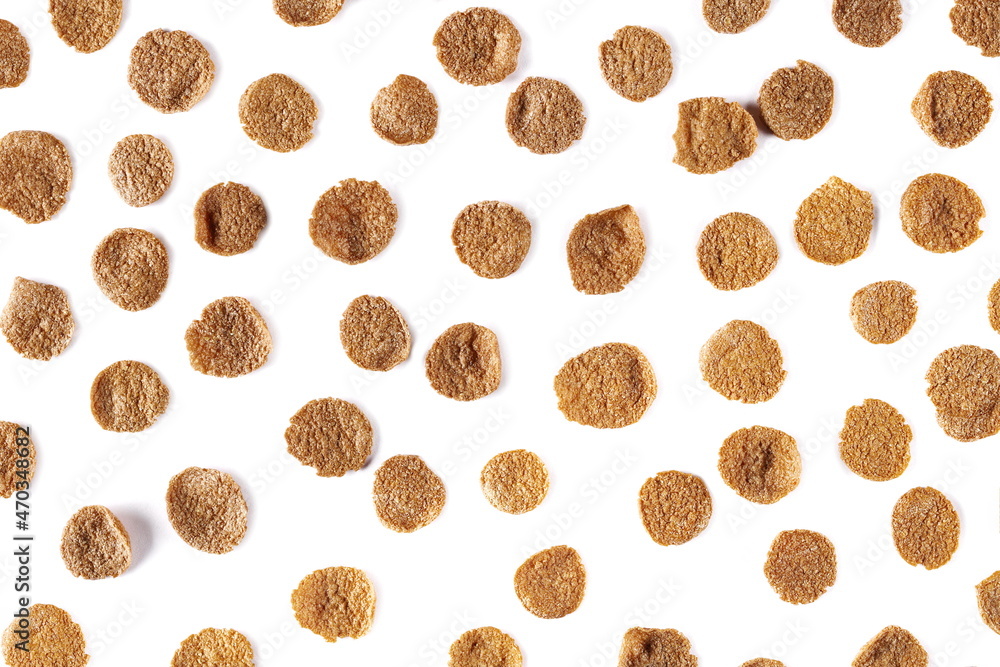 Crunchy corn flakes, cereal, muesli pile with cocoa isolated on white background, top view Crunchy corn flakes, cereal, muesli pile with cocoa isolated on white background, top view