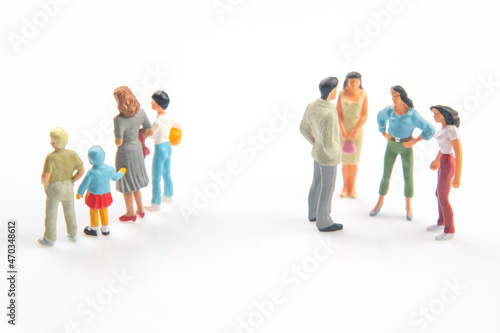 miniature people. concept of family people in relationships on a white background. the problem of fidelity in marriage. raising children in problematic relationships in the family.