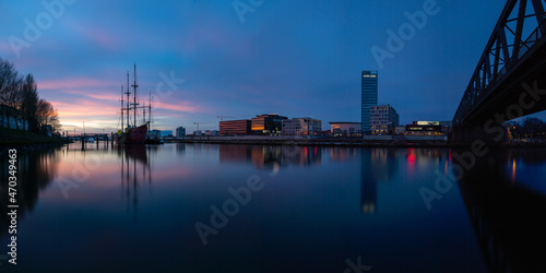 Panorama  Cityscape of the   berseestadt in Bremen  Germany at blue hour with the sunset reflecting at the office buildings