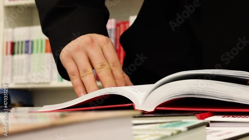 hands of a person reading a book