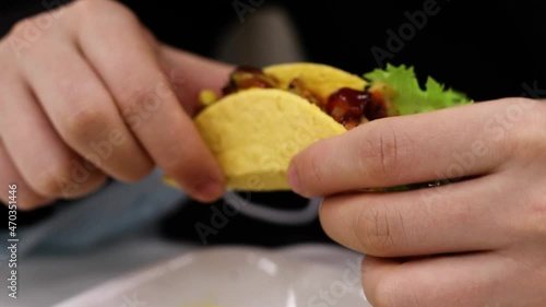 person holding a hot burrito