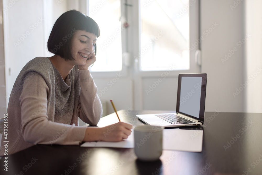 Female university student studying from home Female university student studying from home