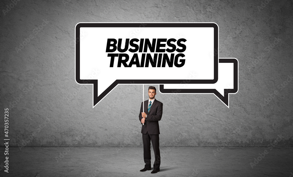 business person in casual holding road sign business person in casual holding road sign