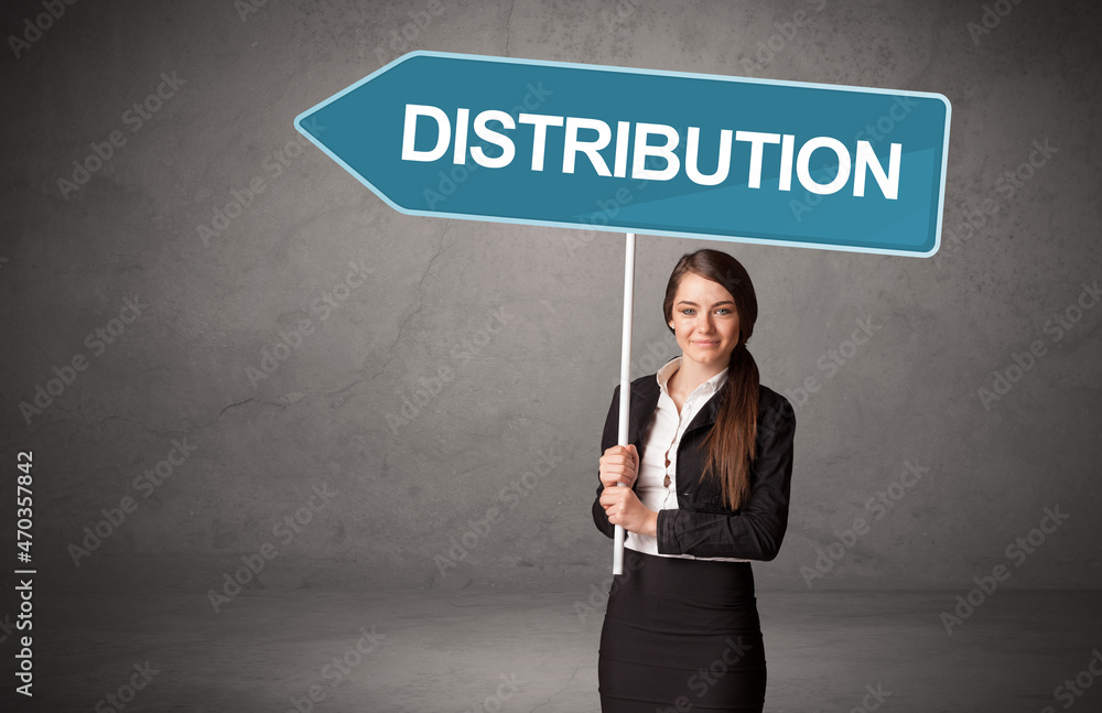 Young business person in casual holding road sign Young business person in casual holding road sign