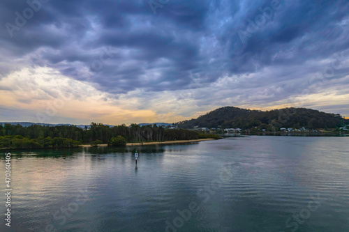 Cloud covered aerial sunrise waterscape © Merrillie