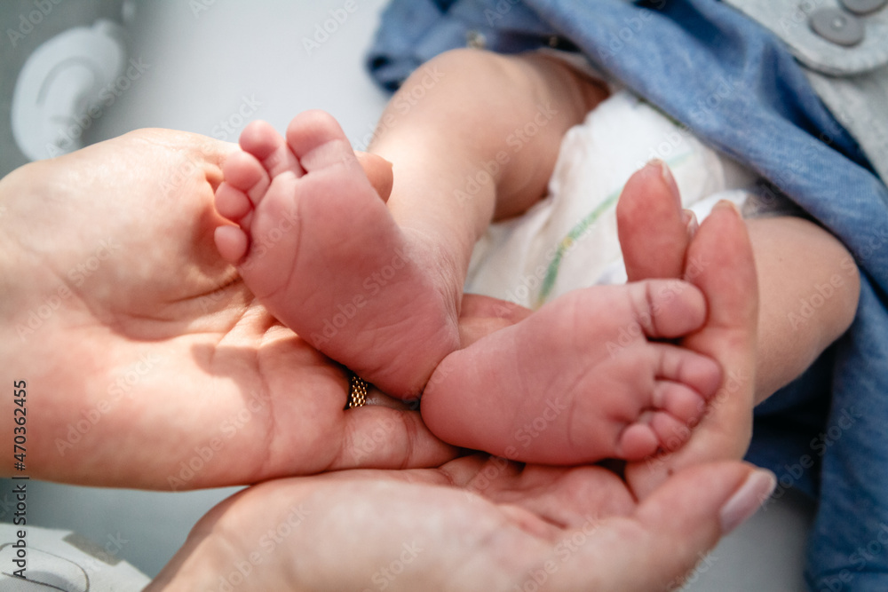 Newborns. Children's legs in the palm of your hand. Close-up. Newborns. Children's legs in the palm of your hand. Close-up.