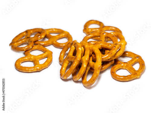 Pretzels with salt on a white background. Flour products. Baking for tea.