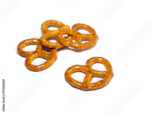 Small pretzels on a white background. Flour products. Baking for tea. Crispy biscuits.