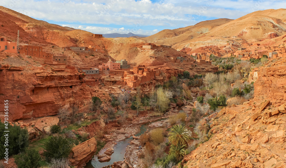 Fototapeta premium .Traditional Berber village in the Atlas mountains, traditional mountain houses and a canyon with a small river