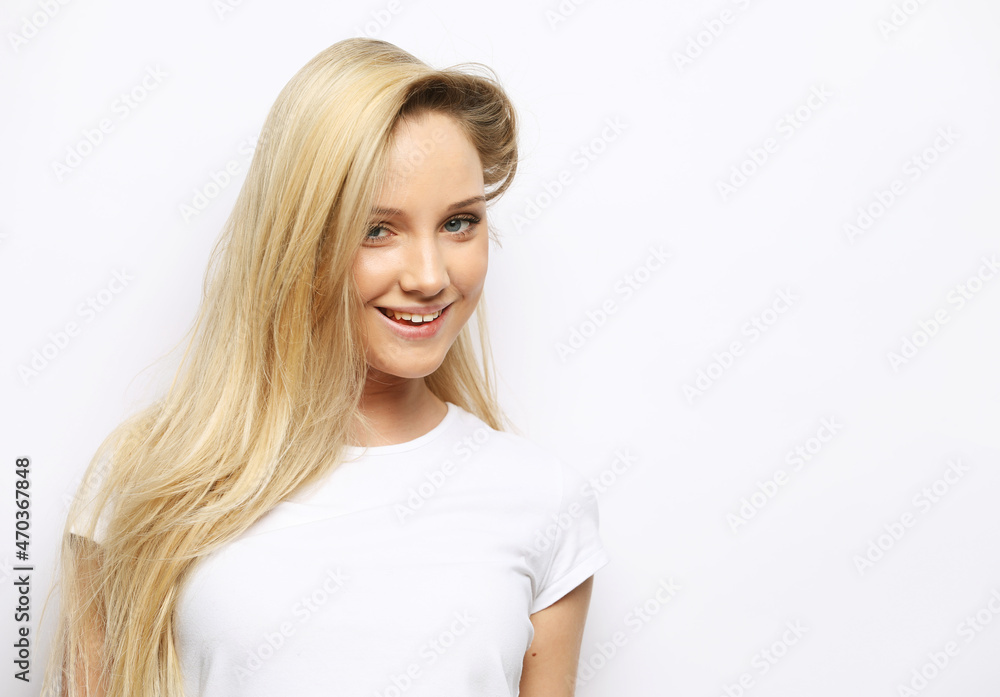 Attractive excited young blond woman wearing casual clothing Attractive excited young blond woman wearing casual clothing