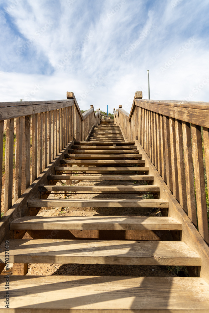Fototapeta premium looking up the stairs at the iconic boardwalk at southport port noarlunga south australia on 14th September 2021