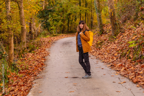 A young woman on a path to Mount Erlaitz in autumn in the town of Irun, Gipuzkoa. Basque Country photo