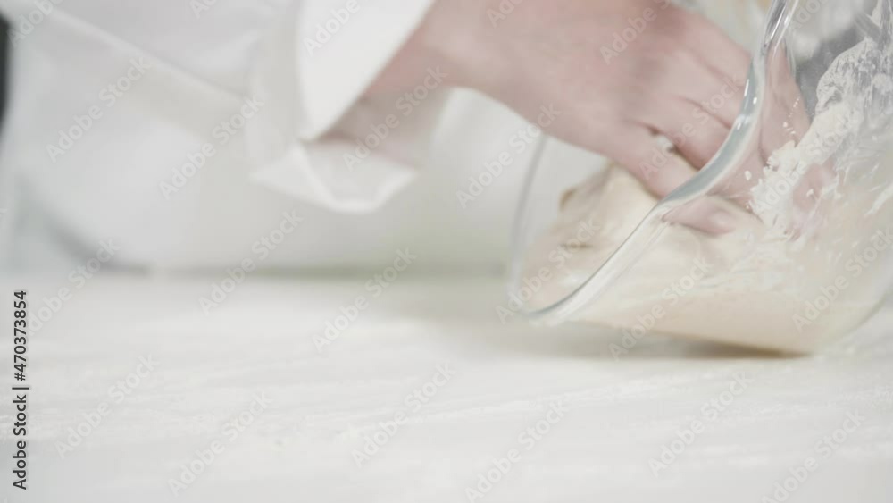 Knitting dough by hand to bake cinnamon rolls. Knitting dough by hand to bake cinnamon rolls.