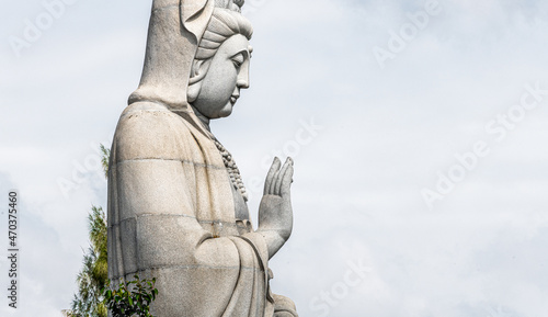 Giant Buddha statue in a temple at Kanchanaburi Thailand