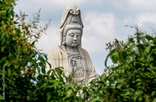 Canvas Print Giant Buddha statue in a temple at Kanchanaburi Thailand
